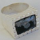 A black flakes ring