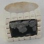A black flakes ring