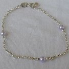 Silver bracelet with purple beads