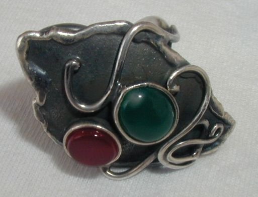 Black silver ring with red and green