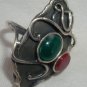Black silver ring with red and green