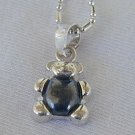 Teddy bear pendant.