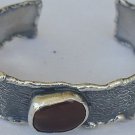 Reddish silver bangle
