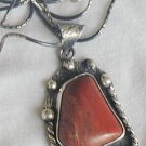 Red loam colored stone pendant