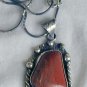 Red loam colored stone pendant