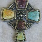 A beautiful artistic metal cross with stones,