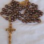 Artificial brown colored pearls beads rosary .