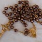 Artificial brown colored pearls beads rosary .