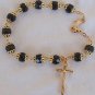 Black glass beads bracelet with golden cross