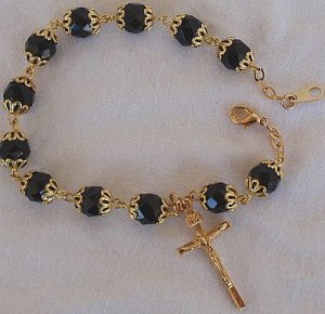 Black glass beads bracelet with golden cross