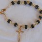 Black glass beads bracelet with golden cross