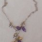 Purple and gold necklace.