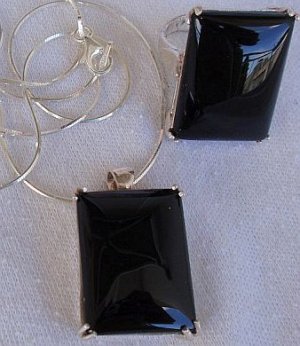 A black agate set ring and pendant
