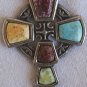 A beautiful artistic metal cross with stones,
