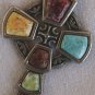 A beautiful artistic metal cross with stones,