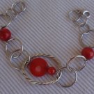 Rounds silver bracelet with coral colored