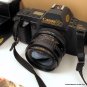 Canon T70 SLR 35mm Camera w 28mm 1:2.8 Lens Flash Bag Manual