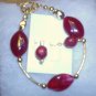 Ruby Red stones with gold spacers and earrings
