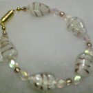 clear stone with purple strips ....