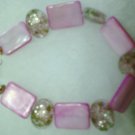 clear stone with pink flowers on it....