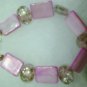 clear stone with pink flowers on it....