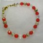 Reds with clear bead bracelet