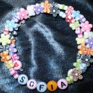 Kids bracelet made with flowers & butterflies! Adjustable custom names or phrases! Memory wire