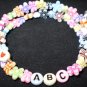 Kids bracelet made with flowers & butterflies! Adjustable custom names or phrases! Memory wire