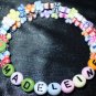 Kids bracelet made with flowers & butterflies! Adjustable custom names or phrases! Memory wire
