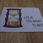 Set of 4 postcards with word design "Life Is Too Short"