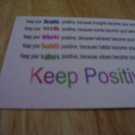 Set of 4 postcards with word design "Keep Positive"