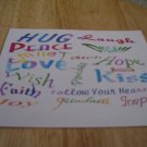 Set of 4 postcards with word design "Hug"