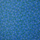 8 3/8" Tiny White and Green Flowers on Light Blue Cotton Fabric Bolt End