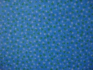 8 3/8" Tiny White and Green Flowers on Light Blue Cotton Fabric Bolt End