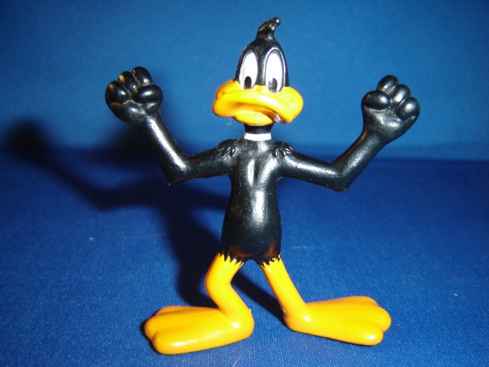 1991 Looney Tunes PVC Daffy Duck Figure Making a Muscle Pose