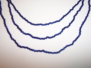 Electric Blue Triple strand necklace with earrings.