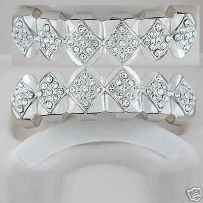 Fifty-Four points of ice silver playa top and bottom grillz set