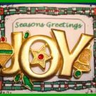 Christmas PIN #0062 JOY Signed GCI Goldtone with Orn, Star & Bell w/Green Holly Christmas PIN #0062 JOY Signed GCI Goldtone with Orn, Star & Bell w/Green Holly