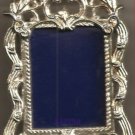 Photo Frame Silvertone Stand Up 2 1/2" wide X 3 3/8" tall--Pic size 2" x 1 1/2" Photo Frame Silvertone Stand Up 2 1/2" wide X 3 3/8" tall--Pic size 2" x 1 1/2"