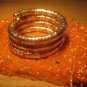 Tri-color (gold/silver/copper) spiral coil bangle