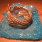 Intricately woven bead cuff in gold