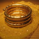 Gold spiral coil metal bangle