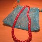 String of red faux pearls