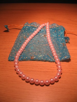 String of light pink faux pearls