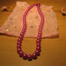 String of Fuschia pink faux pearls