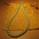 String of light green faux pearls
