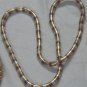 Twist metal necklace in gold, silver and copper