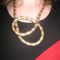 Twist metal necklace in gold, silver and copper