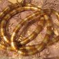 Twist metal necklace in gold, silver and copper