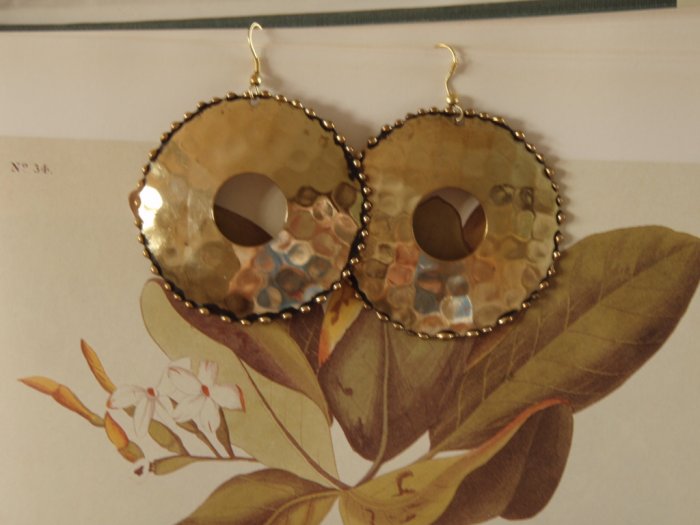 Gold tone dimpled disk earrings